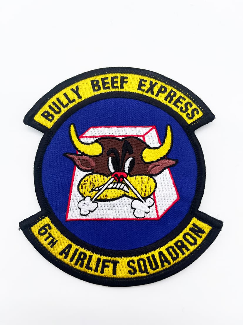 Honor the legacy of the 6th AS. This patch features the iconic winged steer mascot, symbolizing the squadron’s WWII roots and its enduring mission to deliver the goods anywhere on earth.